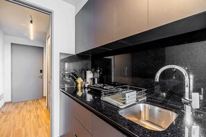 Fridge, microwave, stovetop, coffee/tea maker