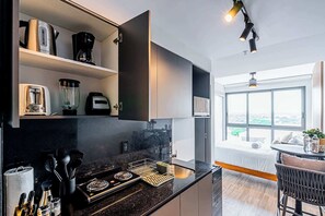 Fridge, microwave, stovetop, coffee/tea maker