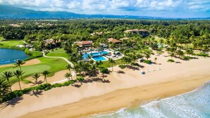 A resort with a large pool, beach, and golf course. - Bahia Beach Steps from Ocean 3BDRM- Ocean View (Herreras)