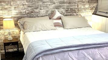 1 bedroom, desk, iron/ironing board, travel crib