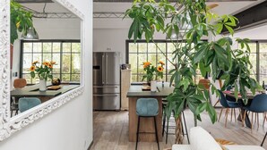A modern kitchen with a large island, stainless steel appliances, and large windows. - Upstays Pool 200m² Villa Near Beach (Cannes)