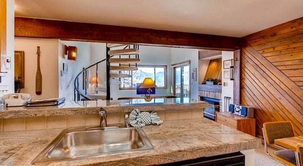 Enjoy cooking in this well-equipped kitchen with a central island, range hood, and oven.