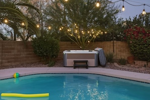 A backyard with a swimming pool, a hot tub, and string lights. - Sparkling SaltwtrPool•Spa•Firepit•Netflix•NFL+ (Phoenix)
