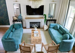 Smart TV, fireplace, table football, books