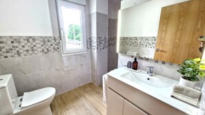 Shower, hair dryer, towels, soap