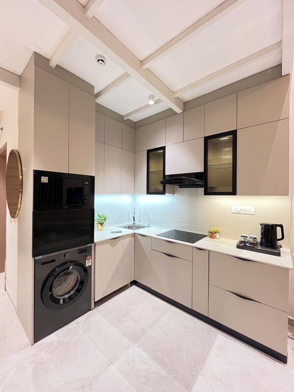 Microwave, oven, stovetop, dishwasher - Luxe Duplex Studio apartment in Gurugram (Gurugram)
