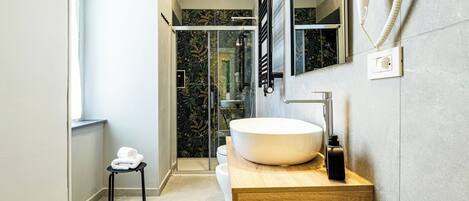 Shower, free toiletries, hair dryer, slippers