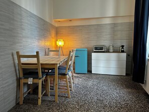 Exclusive Quadruple Room, City View | Private kitchen | Fridge, microwave