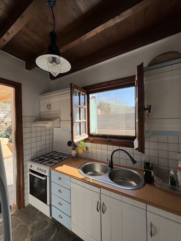 Fridge, microwave, coffee/tea maker, cookware/dishes/utensils
