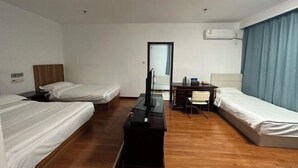 A hotel room with two beds, a desk, a chair, and a TV. - Beijing Zhonggong Hotel (Beijing)