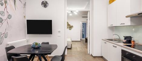 Comfort Apartment, 1 King Bed with Sofa bed, Non Smoking | 1 bedroom, in-room safe, blackout drapes, iron/ironing board