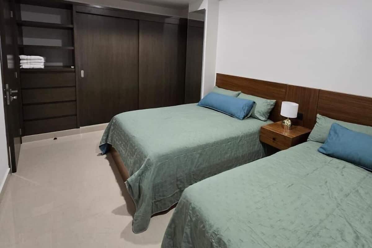 Deluxe Apartment, 2 Bedrooms, Terrace, City View | Blackout drapes, iron/ironing board, free WiFi