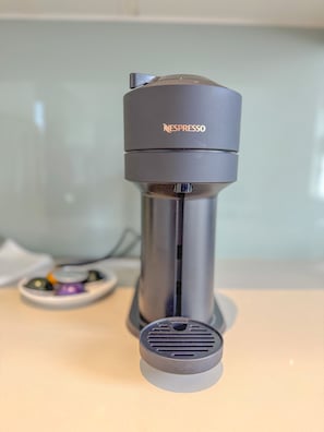 Enjoy freshly brewed espresso with our in-room coffee machine.
