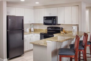 Full-sized fridge, microwave, oven, stovetop - Ocean Walk Resort Condos (Daytona Beach)