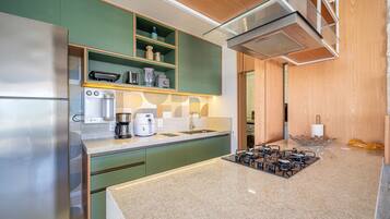 Villa | Private kitchen | Fridge, microwave, oven, stovetop