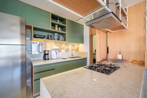 Villa | Private kitchen | Fridge, microwave, oven, stovetop