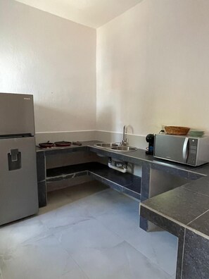 Deluxe Quadruple Room, Lagoon View | Private kitchen | Espresso maker, griddle, cleaning supplies