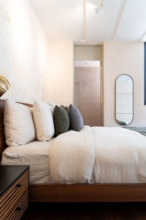 1 bedroom, desk, iron/ironing board, travel crib