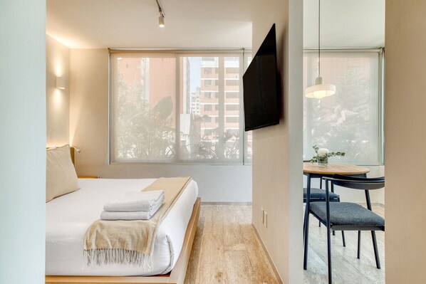 1 bedroom, desk, iron/ironing board, travel crib