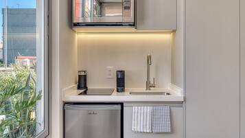 Microwave, stovetop, coffee/tea maker, cookware/dishes/utensils