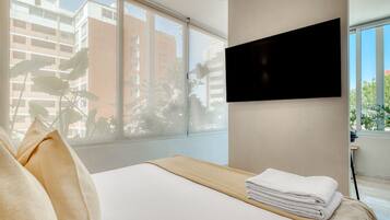 1 bedroom, desk, iron/ironing board, travel crib