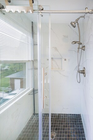 Shower, hair dryer, towels, soap