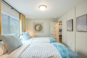 Cozy retreat with a large bed and stylish mirror.