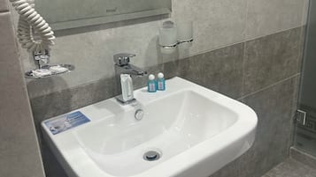 Hair dryer, towels, soap, shampoo