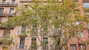 A multi-story building with balconies and windows.
