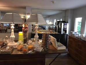 A buffet setup with various food items and a teddy bear decoration. - Balladins Lyon Est (Saint-Quentin-Fallavier)