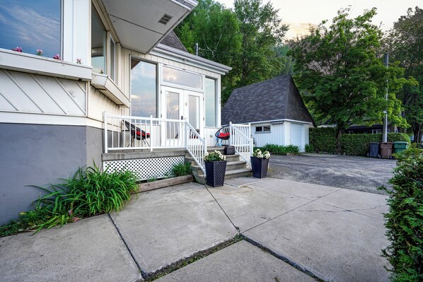 A residential house with a front porch, a covered entryway, and a driveway.