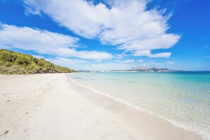 On the beach, sun-loungers