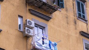 A building with multiple balconies, air conditioning units, and a sign for "materiel rentals." - Materdei Rooms (Naples)