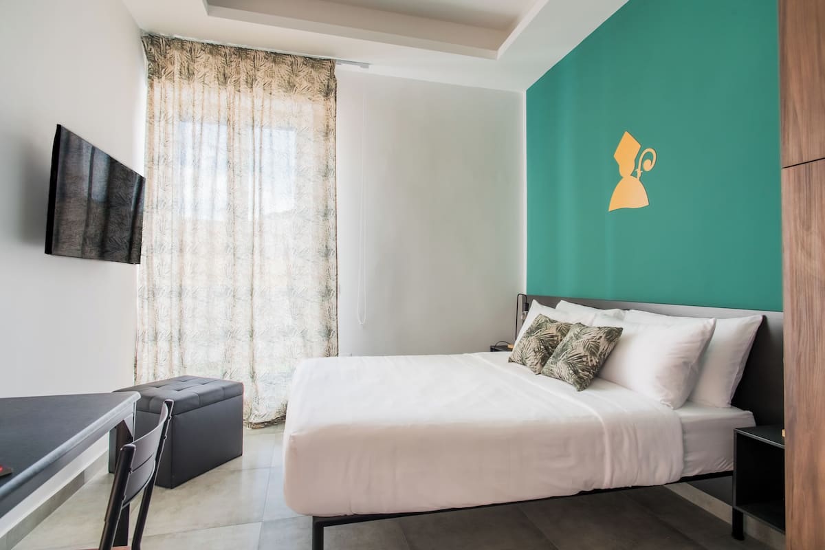 Deluxe Double Room, Balcony, City View | 1 bedroom, minibar, in-room safe, blackout drapes