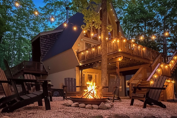 Tucked among the trees, this A-frame cabin feels like a private woodland escape—quiet, cozy, and completely immersed in nature.