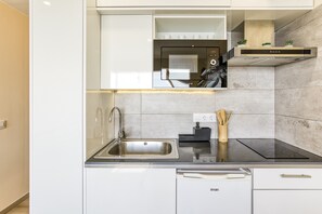 Fridge, microwave, stovetop, coffee/tea maker