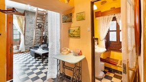 A room with a checkered floor, a sewing machine, a telephone, and a sink. - Holiday Home 'San Francisco 1' with Mountain View, Private Terrace and Wi-Fi (Telde)