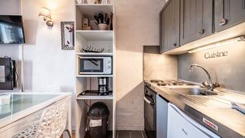 Microwave, stovetop, coffee/tea maker, electric kettle