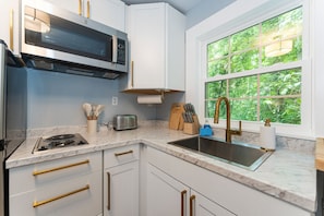 Fridge, microwave, stovetop, coffee/tea maker