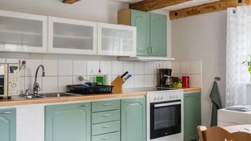 Fridge, microwave, cookware/dishes/utensils