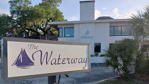 A sign for "The Waterway" with a sailboat logo.