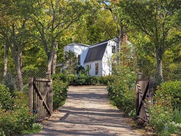 House is on 2 acre wooded lot.
