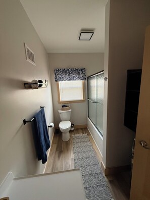 Shower, towels, soap, toilet paper