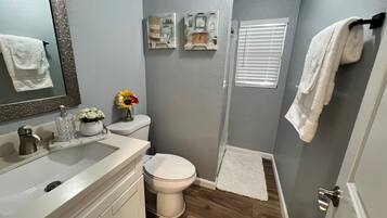 Shower, hair dryer, towels, soap