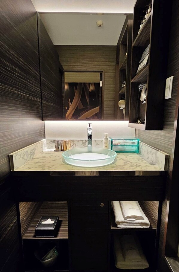 A modern bathroom with a marble sink, dark wood cabinetry, and a mirror above the sink. - HOTEL SULATAYAMAGATA AIRPORT - Adults Only (Higashine)