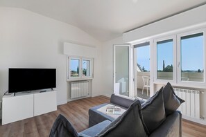 Family Apartment, Multiple Bedrooms (Matta Apartment 400m From The Lake) | Living area | 21-inch Smart TV with cable channels