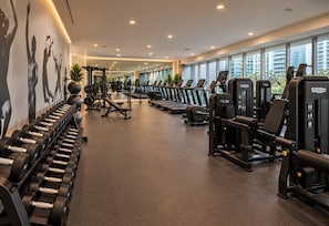 A gym with treadmills, dumbbells, and weight machines. - LUXURY 1BR/1BA ICON-BRICKELL MIAMI (Miami)