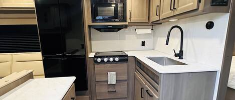 Fridge, microwave, stovetop, coffee/tea maker