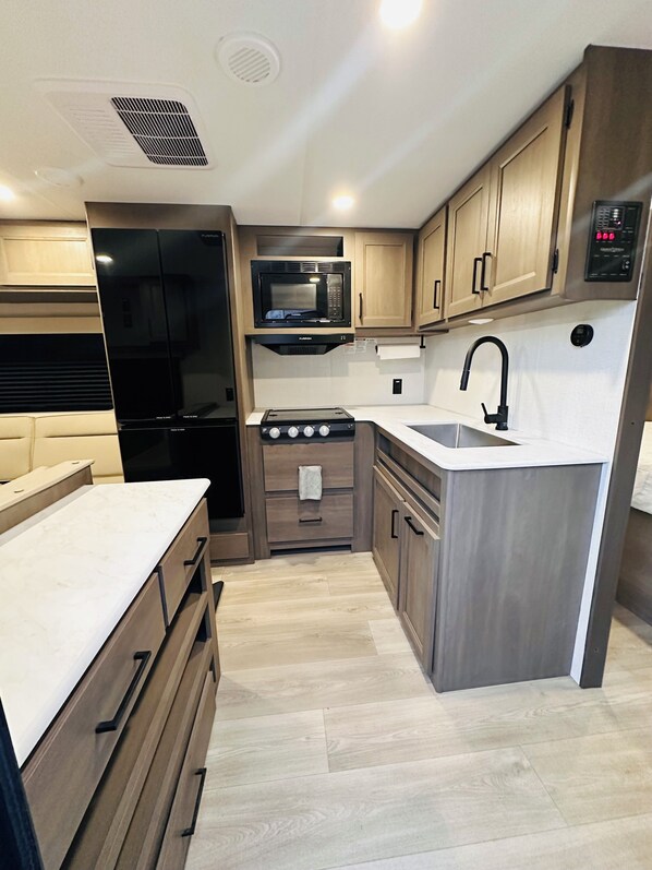 Fridge, microwave, stovetop, coffee/tea maker