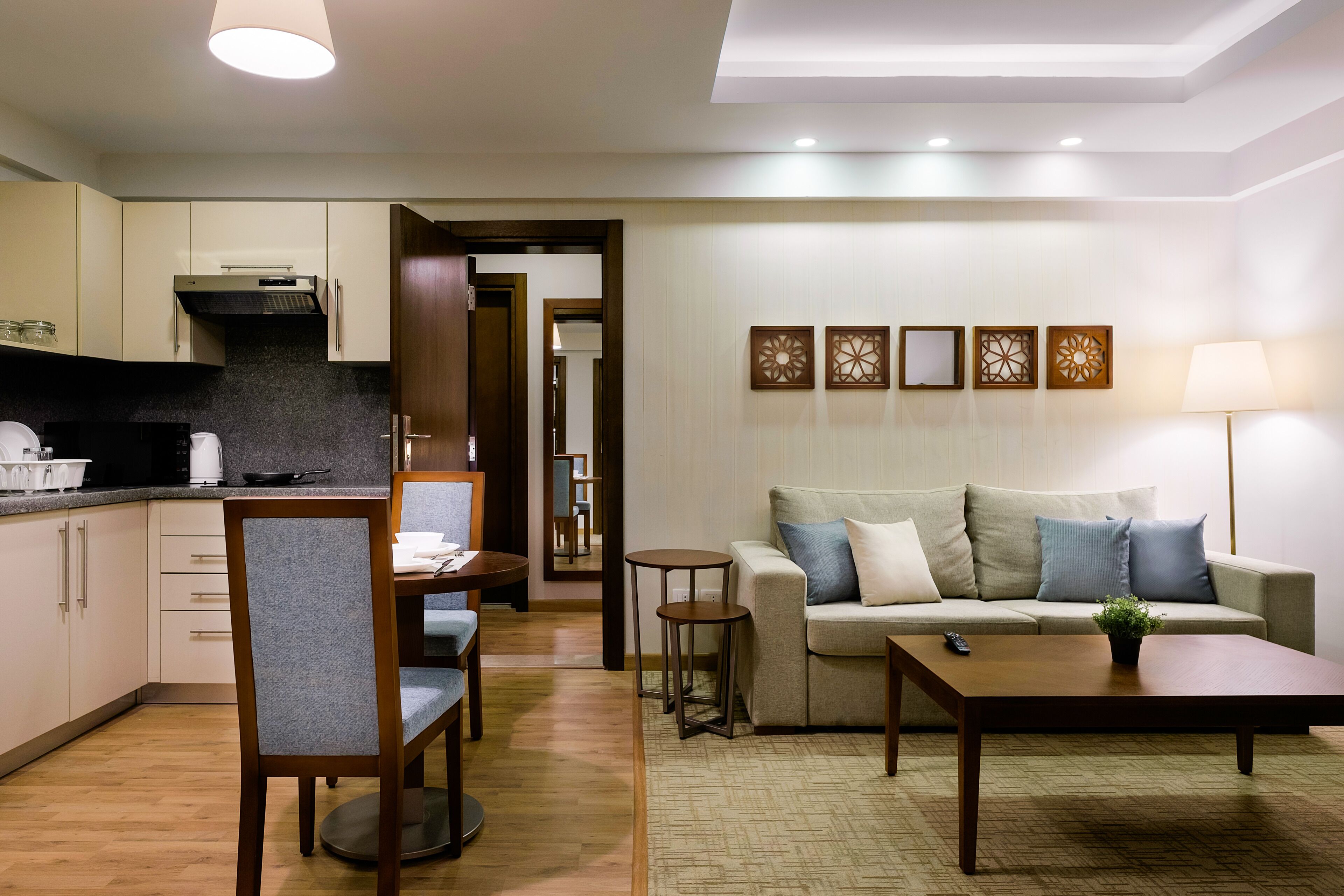 Family Apartment, Multiple Beds, Kitchen | Living area | 55-inch Smart TV with cable channels, Netflix, streaming services